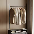 Metal Clothes Hanger with Light Beige Shirts and Tops in Wooden Room