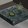 Green Marble Coffee Table with Green Fruits Black Bowl and Glass Vase Holding Green Plants