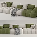 Modern Sectional Sofa with Green and Beige Plush Cushions and Cozy Throw Blanket