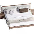 Modern Wooden Double Bed with White Sheets Pillows and Nightstands with Lamp