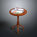 Daily Necessities Arranged On Wooden Round Side Table With Tray And Small Bottle