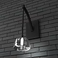 Modern Black Metal Wall Sconce With Transparent Spherical Lampshade On Dark Brick Wall