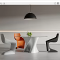 Modern Dining Table Set With Unique White Base White Orange Black Chairs And Green Plant