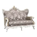 Elegant European Style Sofa With Ornate Carved Frame And Floral Patterned Fabric