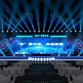 Contemporary Stage Setup With Blue Lighting Large Screen Display Text And Geometric Decor 3d model