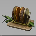 Assorted Colored Bread Slices Displayed on Wooden Tray With Green Leaf Accents