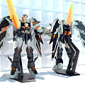 Detailed Robot Models With Orange Black Accents Wings And Glowing Parts On