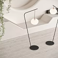 Stylish Modern Floor Lamps With Black Stands And White Globe Shades In Interior Space