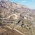 Aerial Planning of Residential Complex With Mountainous Surroundings Multi Story Buildings Roads and Green Spaces