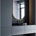 Modern Bathroom Vanity With Oval Mirror Black Sink Gray Cabinet And Striped Wall