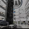 Modern Shopping Mall Interior With Open Space Escalator Glass Walls And Bright Lighting
