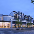 Modern Commercial Street With Contemporary Architecture Glass Facades Trees Shops And Parked Cars In Evening