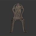 Antique Ornate Metal Chair With Carved Backrest And Intricate Leg Design