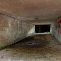 Dilapidated Concrete Tunnel Interior With Graffiti Yellow Black Striped Tape And Dirt Floor 3d model