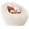 Beige Knitted Single Sofa With Rounded Shape And Red White Floral Cushion