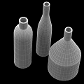 Three Golden Metallic Vases With Shiny Finish And Various Shapes