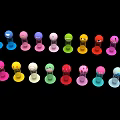 Colorful Small Figurines Art Installation With Vibrant Hues Arranged On Black Background
