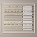 Display of Various Gypsum Molding Styles in White and Off White for Interior Decor