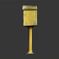 Yellow Metal Mailbox On A Sturdy Post With Small Stickers And Lid