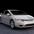 Silver Honda Two Door Coupe With Sleek Lines And Silver Wheels On Gray Carpet