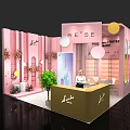 Pink Modern Exhibition Booth With Green Plants Flower Decorations And Reception Counter