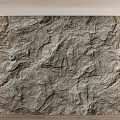 Natural Textured Stone Wall With Wooden Floor And Side Lighting Interior Design