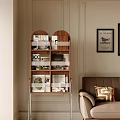 Wooden Bookshelf With Books And Decor Items Near Brown Sofa In Beige Wall Interior Design