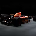 Black and Orange Formula 1 Race Car With Orange ABATECH LOTOS Sponsor Logos