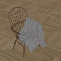 Wooden Spindle Back Leisure Chair With Knitted Blanket On Light Wood Herringbone Floor