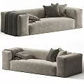 Gray Plush Sectional Sofa With Accent Pillows And Throw Blanket For Modern Living Room