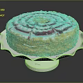 Round Decorative Cake With Red And White Cream Swirls And Yellow Crumbs On White Stand