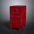 Vintage Red Cabinet With Three Drawers And Wheels On Dark Background