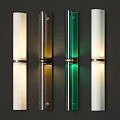 Modern Cylindrical Wall Sconces in White Brown Green on Dark Wall Illuminated
