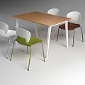 Modern Minimalist Wooden Table With White Legs And Multicolored Metal Leg Chairs Set