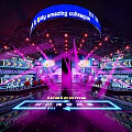 Dynamic Stage Design Featuring Purple Lighting LED Screens And Blue Amazing Collage Banner