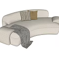 Cozy Beige Curved Bouclé Sectional Sofa With Checkered Tan Pillows And Soft Throw Blanket