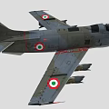 Military Fighter Jet With Camouflage Paint And Weapons Under Wings In Flight