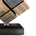 Modern Geometric Floating Sculpture With Gold And Black Grid Structure On Black Base