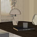 Table Lamp With Wooden Base Fabric Shade On Dark Table With Book Glass And Stone