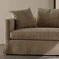Beige Multi seat Sofa With Plush Cushions Green Throw Light Walls And Natural Light Shadows