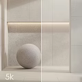 Minimalist Wall Component Featuring Stone Sphere Recessed Lighting And Light Beige Stone Material