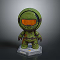 Green Character Model With Orange Visor And Green Armor On Base Stand