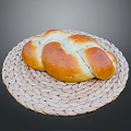 Freshly Baked Golden Brown Braided Bread On Woven Mat Ready For Serving