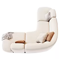 Modern Cream Curved Sectional Sofa With Brown Gray Pillows And Blanket