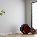 Two Large And Small Tires With Red Rims Marked SF-23 On Wooden Floor White Wall