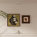 Abstract Painting On White Wall With Decorative Molding Dark Frame And Green Plant Accent