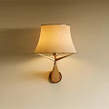 Modern Wall Lamp with Beige Fabric Shade and Gold Metal Base on Light Wall
