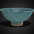 Turquoise Ceramic Bowl Featuring Intricate Decorative Patterns And Light Colored Base