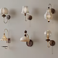 Diverse Decorative Wall Lamps Mounted on Light Colored Wall with Unique Styles 3d model