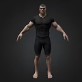 Muscular Man In Black Tight Shirt And Shorts Standing Barefoot On Dark Background